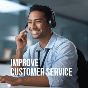 A smiling business man talks on a headset