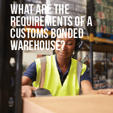 Woman using a scanner on a box in a warehouse aisle