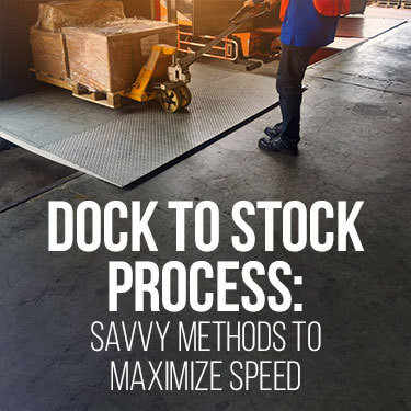 Warehouse worker unloading a truck with a pallet jack