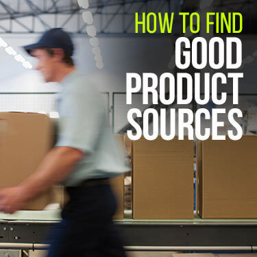 Warehouse worker holding a box while walking next to a conveyor belt