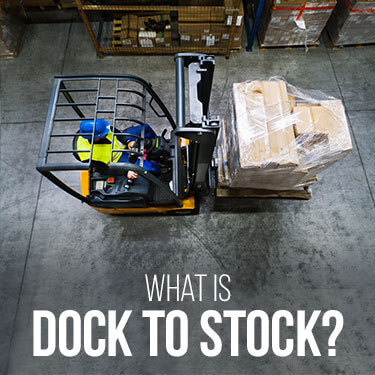 A forklift operator moving a palletized load to a different location in a warehouse