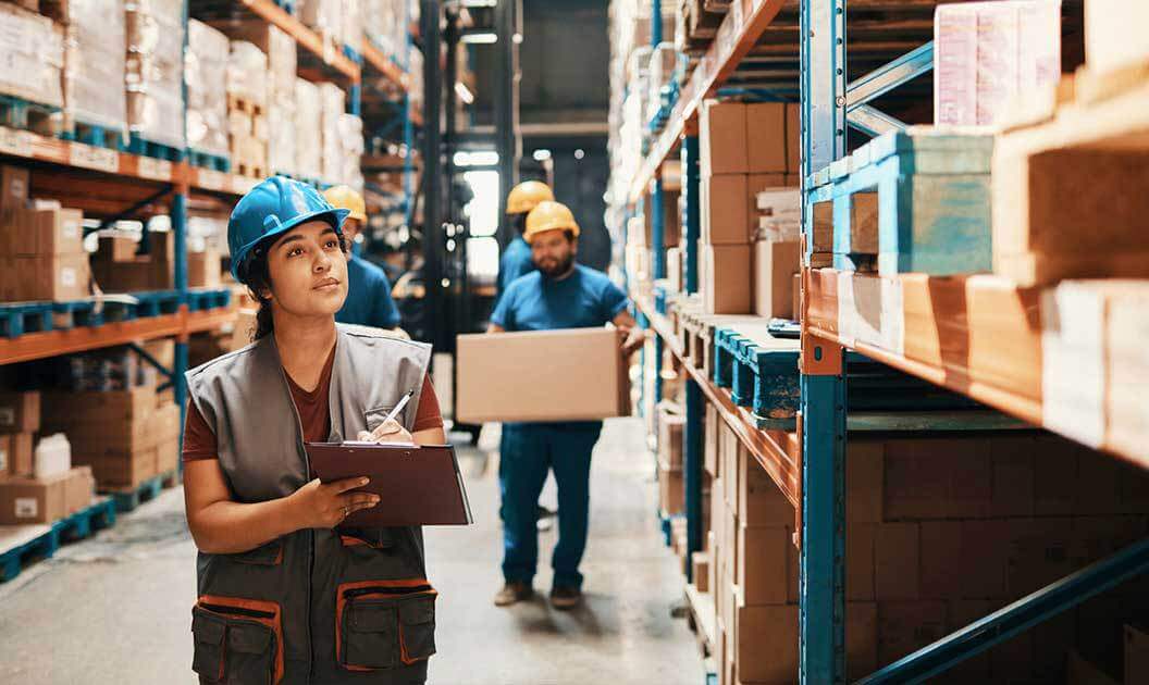 Warehouse workers engaged in the putaway process.