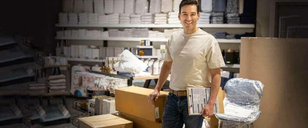 A warehouse worker in a packing area of a facility